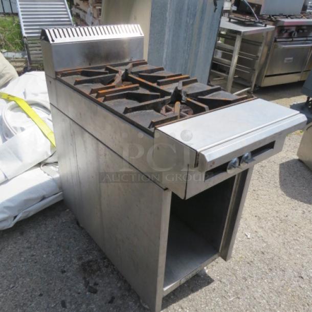 US Range 36-7 natural gas 2 burner range with under storage. Dimensions 18x38x41 inches. Visible wear, functional condition.