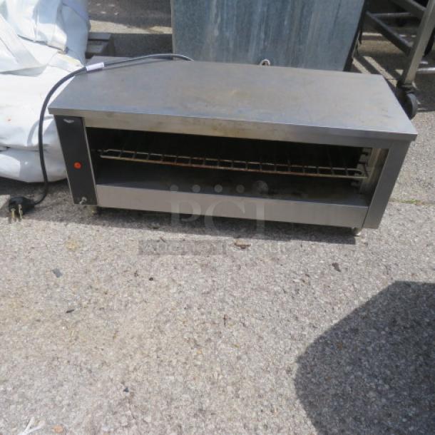 Vollrath Electric Cheese Melter, Model JW30PA, 208 Volt, dimensions 35x14.5x15 inches, unable to test.