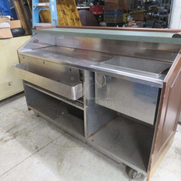 FWE portable bar with mahogany trim, stainless steel under shelf, ice well, bottle rail, and casters. Model AS-CB-6-MW.
