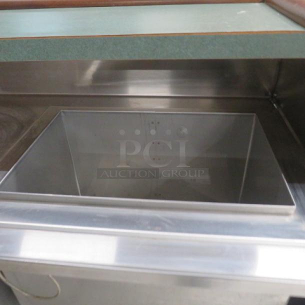 FWE portable bar with mahogany trim, stainless steel under shelf, ice well, bottle rail, Model# AS-CB-6-MW, on casters.