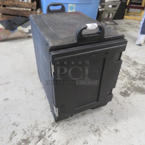 Black Carlisle food transport container, missing side latches, used condition. Features handles and a sturdy build.