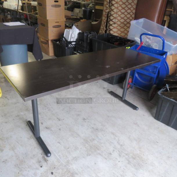 Kimball heavy-duty folding table, brown laminate, 66x24x29 inches. Steel legs, good condition. Ideal for office use.
