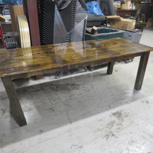 Solid wooden table, 8-foot, with four sturdy wood legs, dimensions 96x38x30 inches. Slight wear, polished finish.