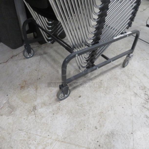 Metal chair cart on casters, no chairs included. Black metal frame, four wheels for easy maneuverability, used condition.