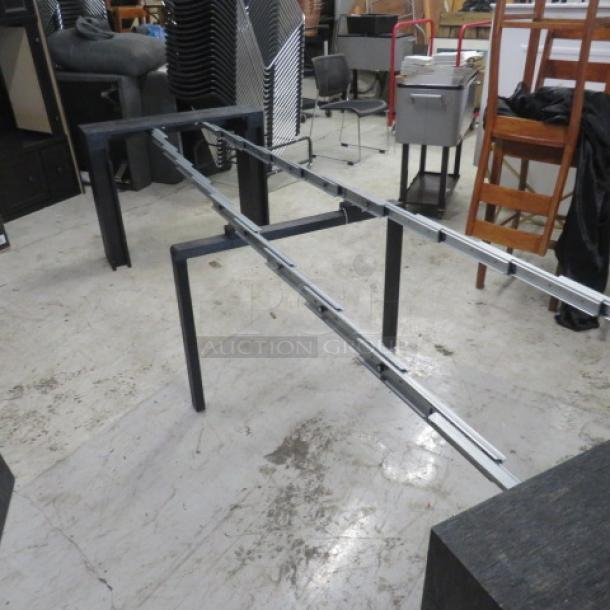 Extendable table with two end pieces and four inserts, extends up to 8 feet. Dimensions: 98x37.5x30 inches. Ideal for various group sizes.