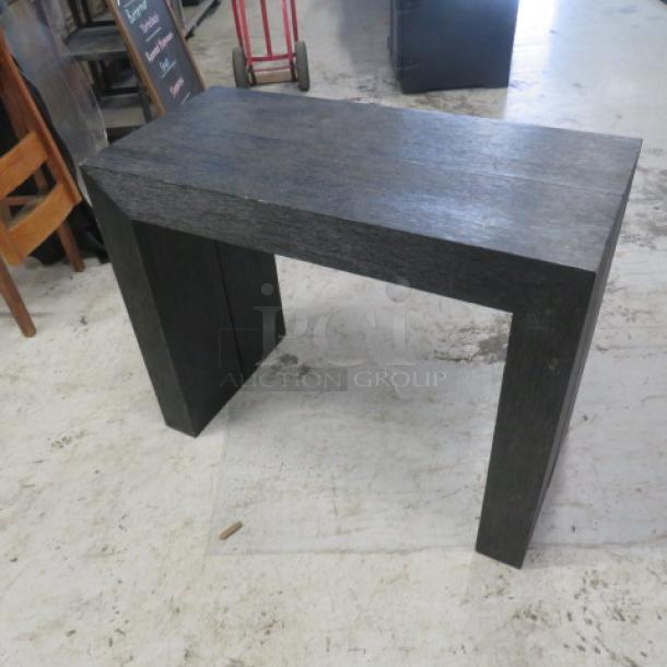 Dark wood extendable table with 2 end pieces and 4 inserts. Extends up to 8 feet. Dimensions 98x37.5x30 inches.