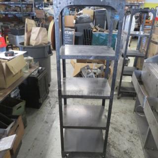 Industrial metal shelving unit with five shelves on casters, 18x14x65 inches. Used condition, sturdy design, ideal for storage.
