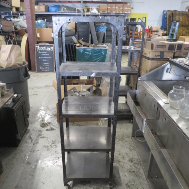 Industrial metal shelving unit with 5 shelves on casters, 18x14x65 inches. Sturdy, functional design for versatile storage.