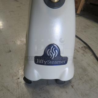 Jiffy Steamer Model J-2000, 120 Volt, in good condition. Shows Jiffy Steamer logo on white base with wheels.