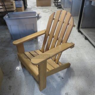 Casa Fiela kids' Adirondack chair in natural wood finish. Sturdy construction, excellent condition. Perfect for outdoor use.