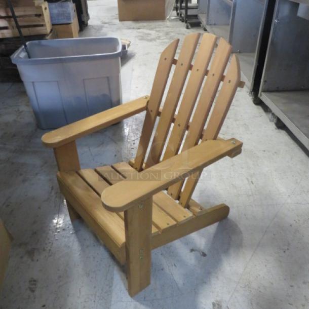 Casa Fiela kid-size Adirondack chair in natural wood finish, sturdy build, excellent condition.
