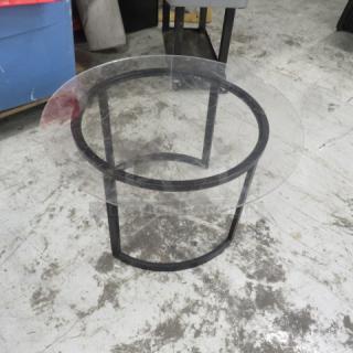 Black metal table base with round plexiglass top, 30x17 inches. Sturdy design, suitable for modern decor.