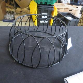 Black 4-inch round display stand with a patterned design, new condition, model 8XBID, ideal for showcasing items.