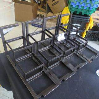 Heavy metal display stands, dimensions 13x5x8 inches, set of 4. Sturdy construction, suitable for retail or exhibition use.
