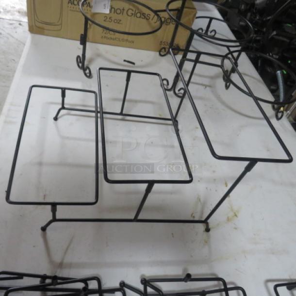 Black metal buffet holder with three rectangular sections, sturdy frame, perfect for events. Price: $27.99 each, 4XBID.