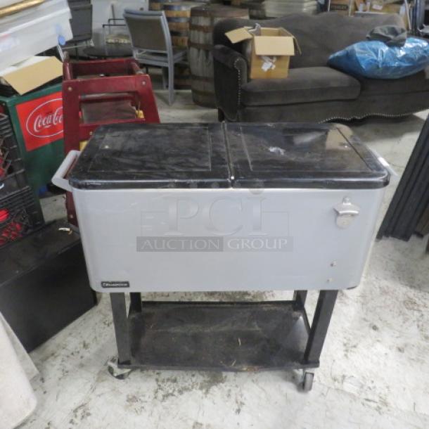 Pearington 80 quart rolling ice/beverage cart with under shelf and bottle opener, silver and black, used condition.