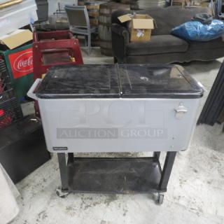 Pearington 80 quart rolling ice/beverage cart with under shelf and bottle opener, silver and black, used condition.