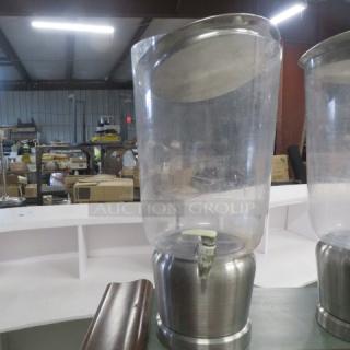 Stainless steel/poly XL beverage dispenser, used condition, clear body, sturdy base, with spigot, ideal for events.