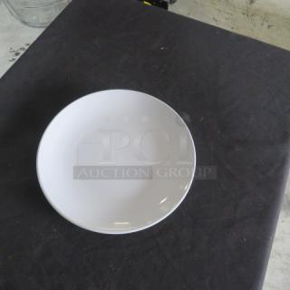 Acopa 10.5" bright white plate, new condition, ideal for dining settings, model 12XBID.