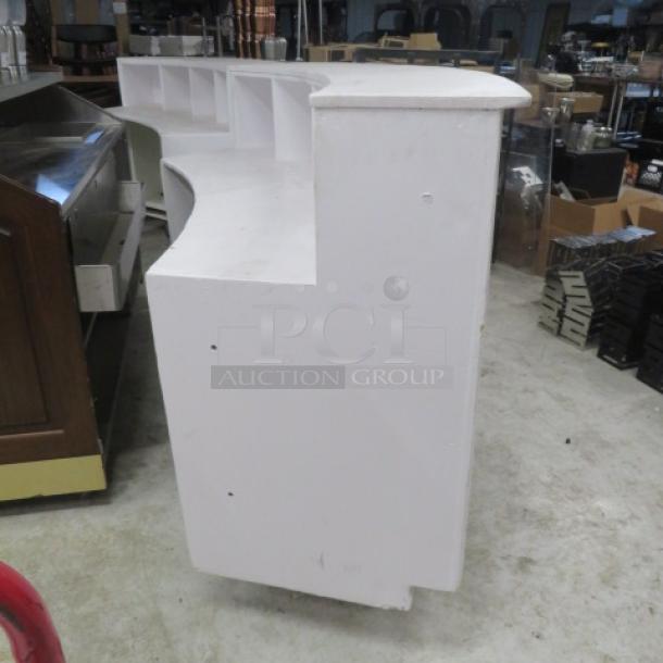 White wooden curved portable bar, 77x30x42 inches, with under storage. Suitable for hosting, in good condition.