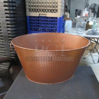 Copper hammered beverage holder, 21x14.5x11 inches, in good condition with handles, ideal for storing drinks.