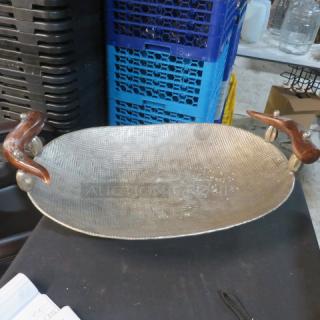 Hammered oval serve tray with antler handles, 28.5x16 inches, textured surface, unique design, excellent condition.