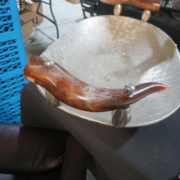 Unique hammered oval serve tray with antler handles, 28.5x16 inches, textured surface, rustic appeal.