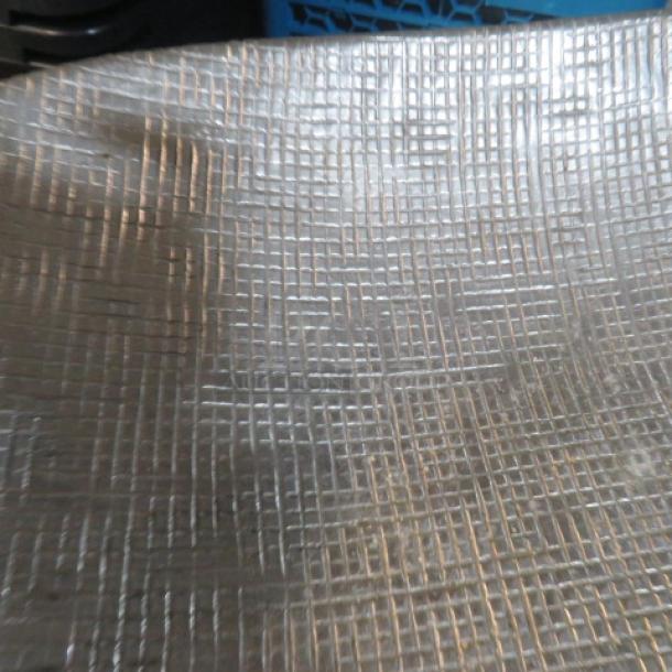 Hammered oval serve tray with antler handles, 28.5x16 inches, unique textured metal, elegant serving piece.