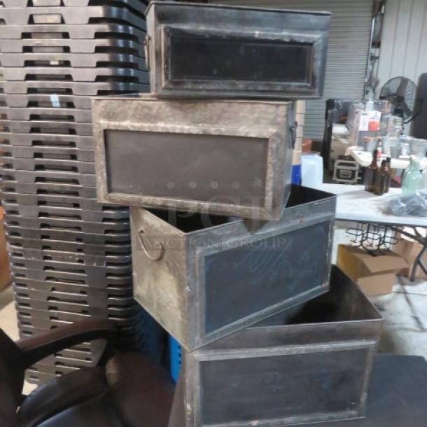 Assorted metal boxes with chalkboard fronts, varying sizes, and used condition. Ideal for labeling and storage.