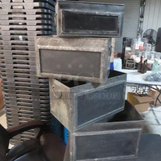 Assorted metal boxes with chalkboard fronts, varying sizes, and used condition. Ideal for labeling and storage.