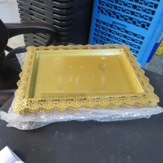 Gold tray measuring 14.5x10.5 inches with intricate lace-like border design. Excellent condition, shiny finish.