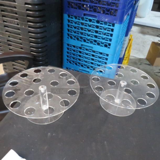 Clear acrylic holders with circular slots, model 3XBID, in good condition, displayed on a black surface.