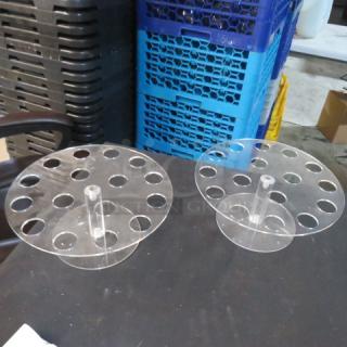 Clear acrylic holders with circular slots, model 3XBID, in good condition, displayed on a black surface.