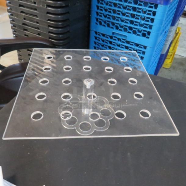 Clear acrylic holder with multiple circular cutouts, square base, and central column. Excellent condition.