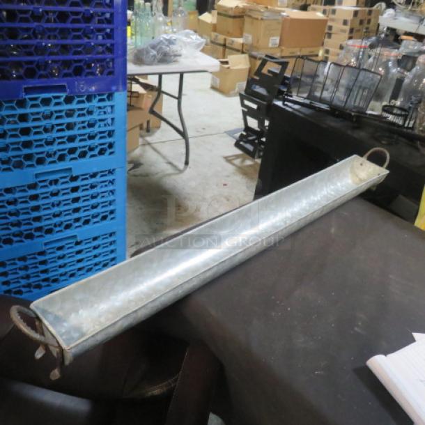 Galvanized trough server, 36x4x3 inches, with rope handles. Used condition, ideal for serving or decor.