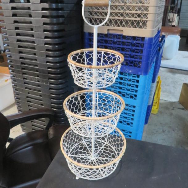 Three-tier basket with wire netting and wooden rims, metal stand, and handle. Ideal for storage or display. Good condition.