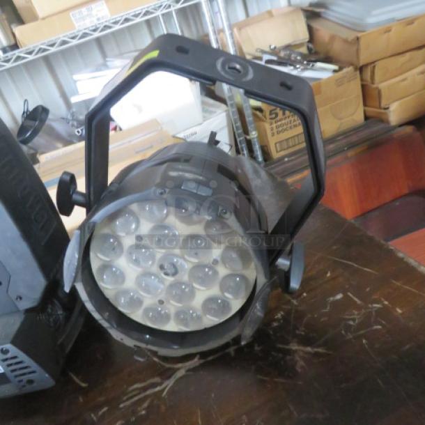 Elation Arena Par Zoom stage light, showing lens array and mounting bracket, in good condition. Model tag visible.
