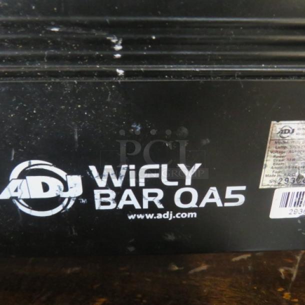 ADJ Wifly Bar QA5 wash light, black casing, visible brand logo and label with model and serial number. Slight surface wear.