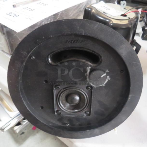 Bose Free Space DS-16F loudspeaker, black, model DS 16F, featuring volume dial and speaker grille, good condition.