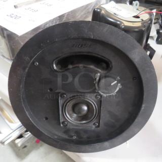 Bose Free Space DS-16F Loud Speaker, black, circular design, visible volume control, brand marking on surface, used condition.