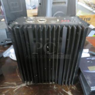 ETC ES 750 Dimmer, 120/230 Volt, black with ribbed design, minor wear. Features control panel and ventilation.