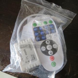 New LED dimmer with remote control, DC12-24V, in packaging. Features adjustable brightness settings.