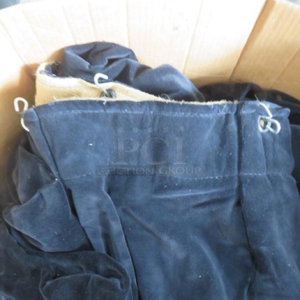 One lot of 5 heavy-duty black velvet stage curtains, flame retardant, 6ft x 11.9ft, in a box with reinforced grommets.