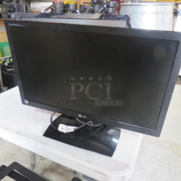 Seiki 24 Inch LED LCD Flatscreen, model SE242TS. Black frame, good condition. Auction tag visible on screen.