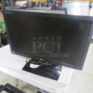 Seiki 24 Inch LED LCD Flatscreen, model SE242TS. Black frame, good condition. Auction tag visible on screen.