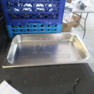 Full-size 2.5 inch hotel pan in stainless steel; used condition, ideal for commercial kitchens. No visible labels.