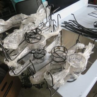 Lot of black metal chafer fuel holders, wrapped in plastic, used condition. Ideal for catering or event use.