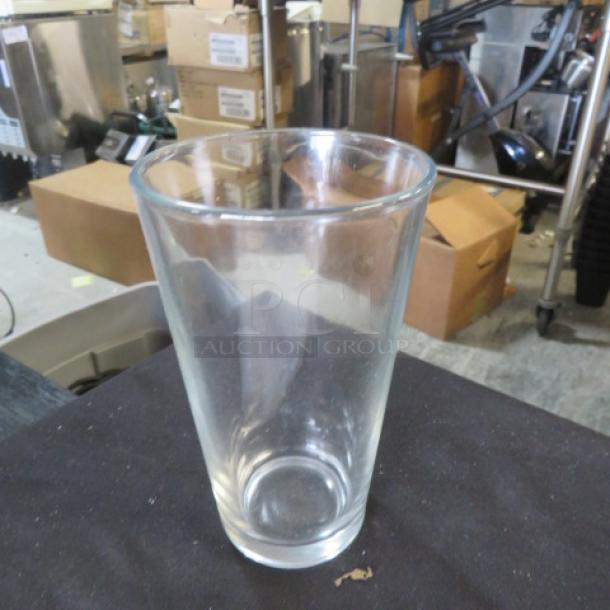 Clear water/beer glass, model 9XBID, with a smooth rim and slight taper. In good condition, no visible markings.