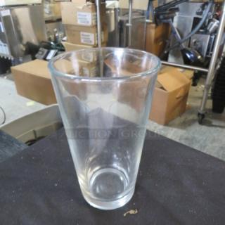 Clear water/beer glass, model 9XBID, with a smooth rim and slight taper. In good condition, no visible markings.