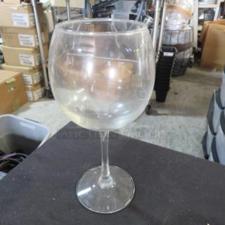 Clear stem wine glass, 12XBID model, in good condition, round bowl, no visible chips or cracks.